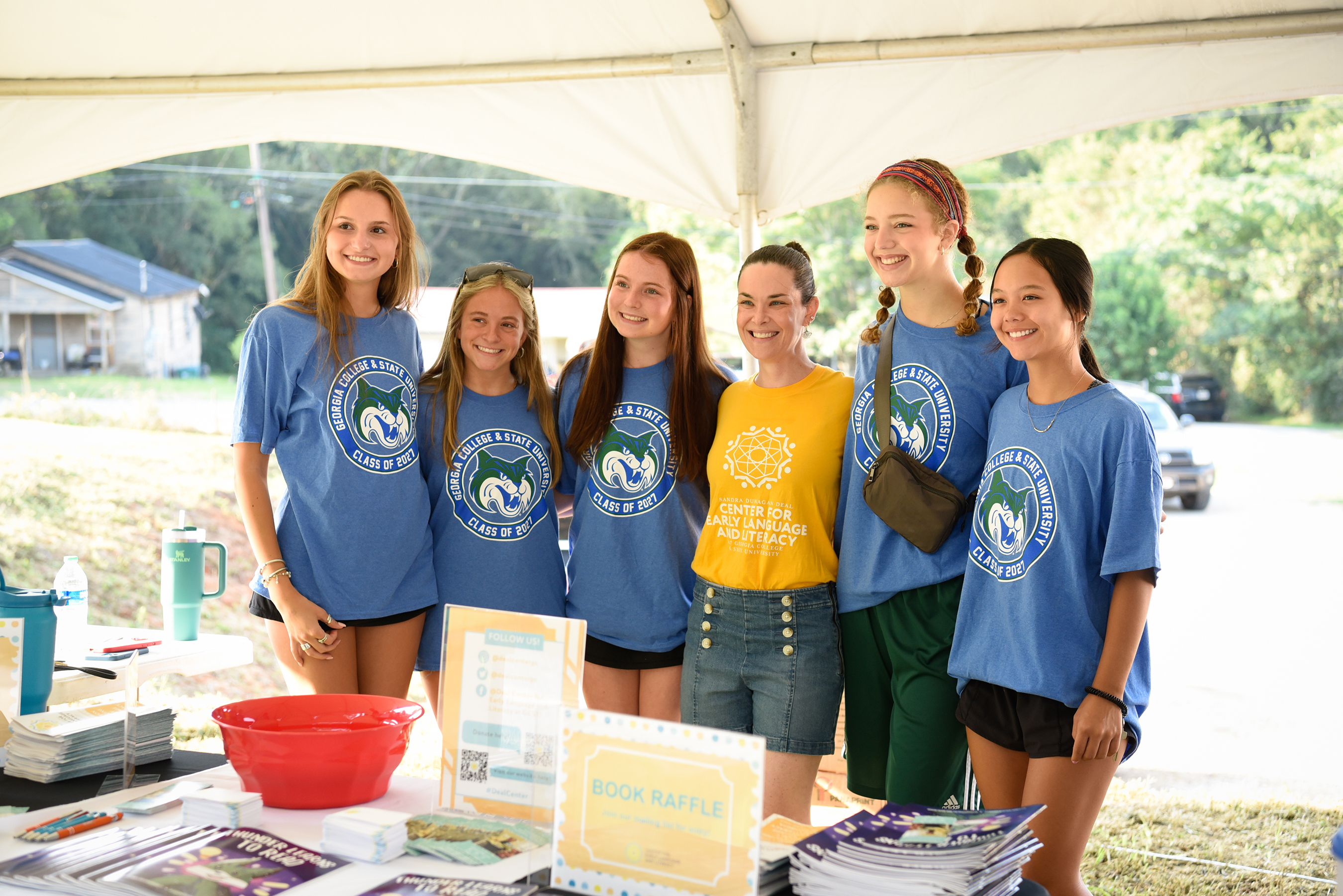 Students at book raffle table for GCSU Gives Day
