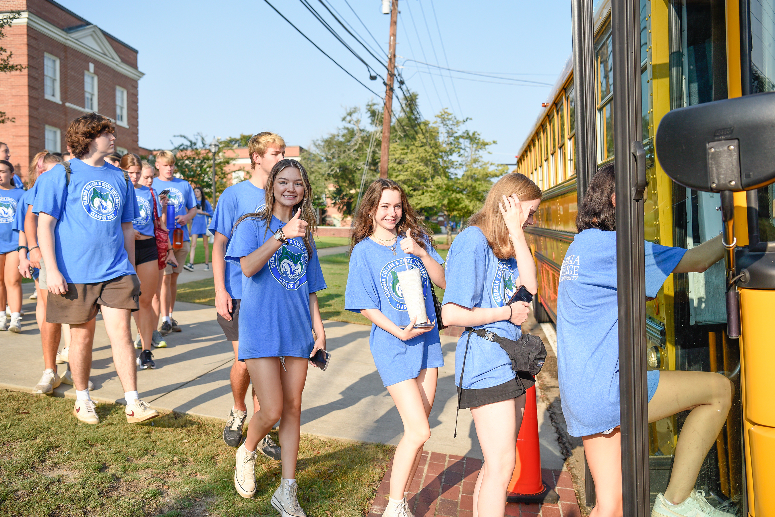 Students board bus for their assigned work locations during GCSU Gives Day