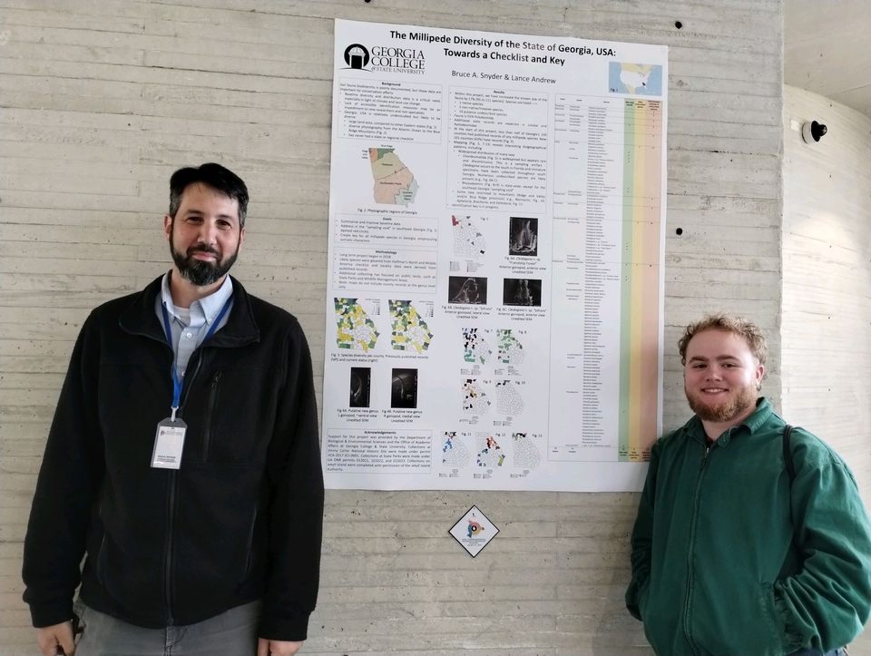 Dr. Synder and Andrew Lance at Lance's research poster in Colombia.
