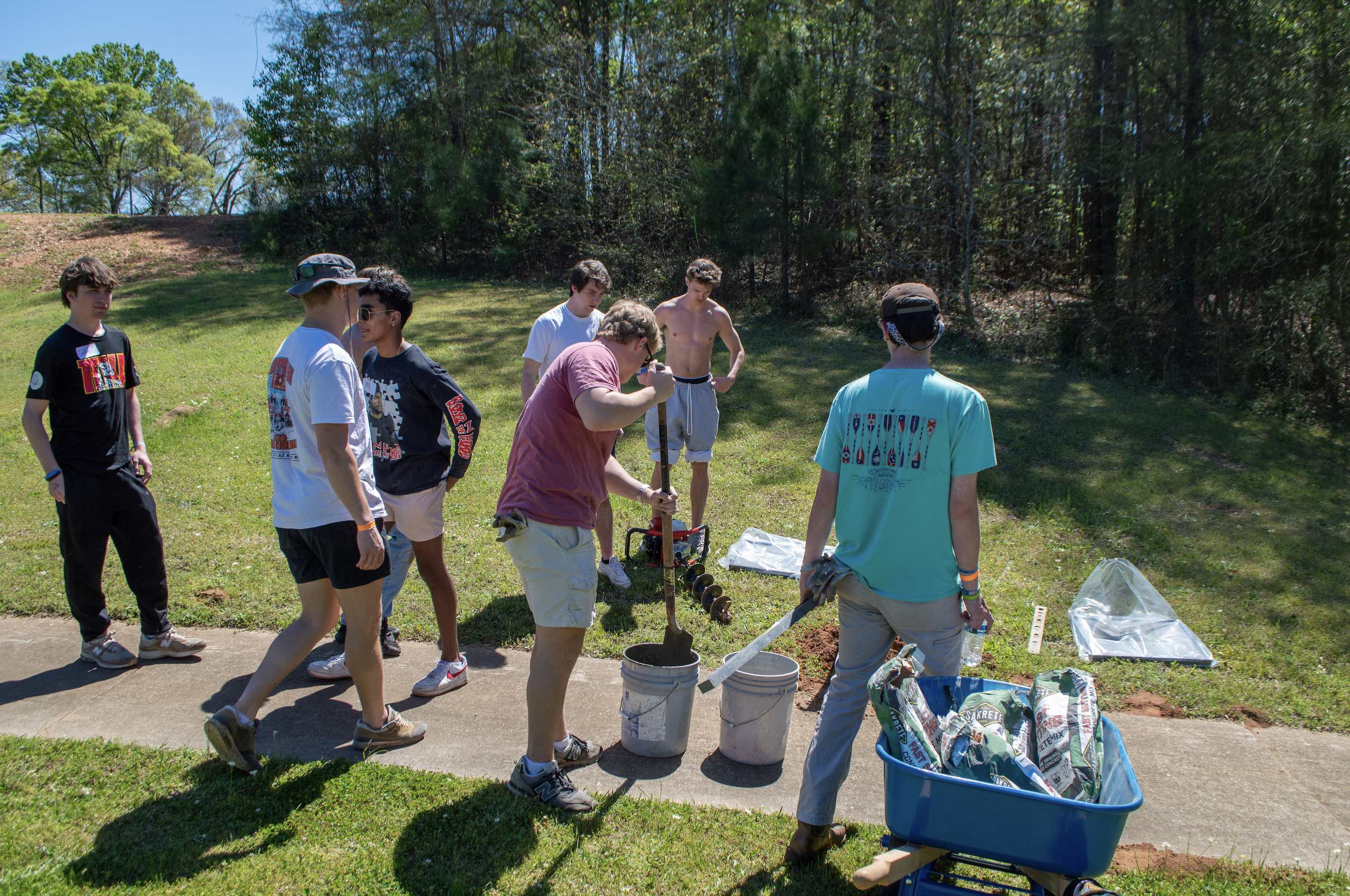 Members of Pi Kappa Alpha Fraternity helped install Tale Trail storyboards.