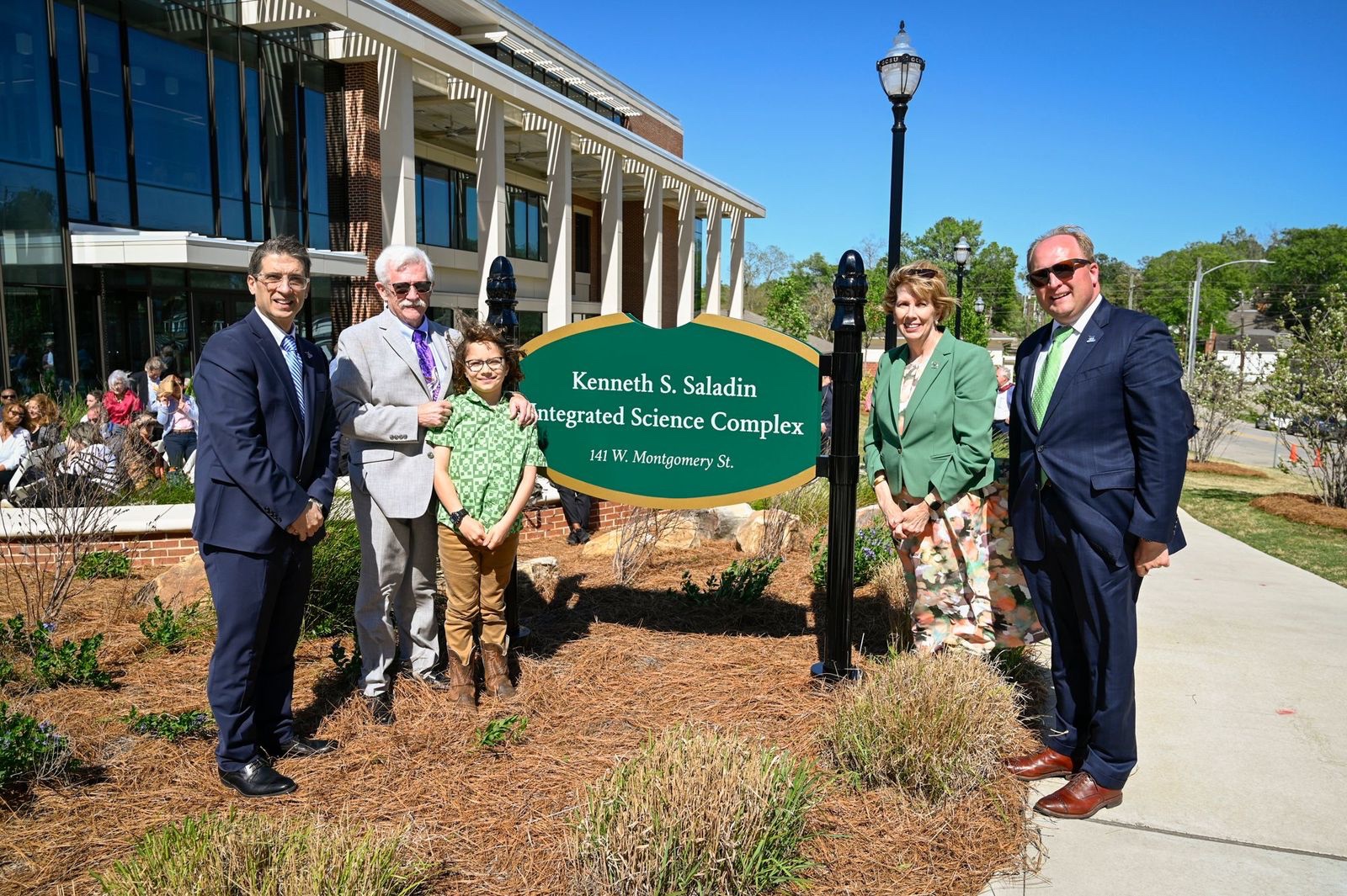 From left: Provost Dr. Costas Spirou, Dr. Kenneth Saladin with his grandson, President Cathy Cox and Vice President of University Advancement Seth Walker.