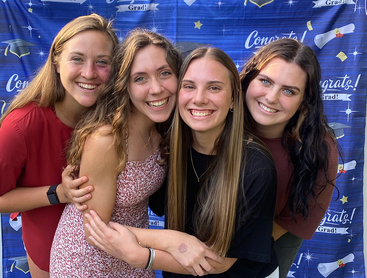 Macy, at left, celebrates graduation with friends. Macy advises incoming GCSU students, "Get to know as many people as you can."