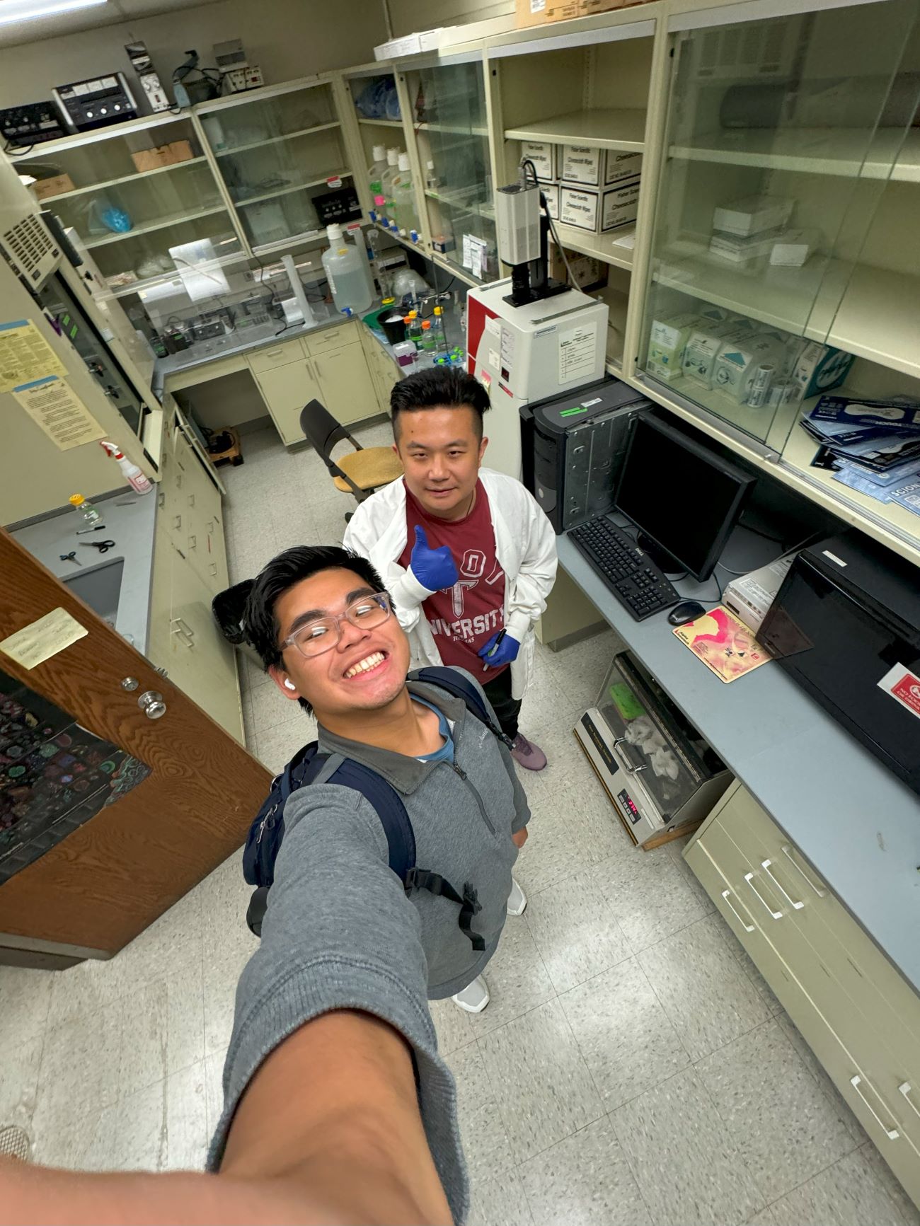 Chu takes a selfie with a friend in the lab storage room at Notre Dame.