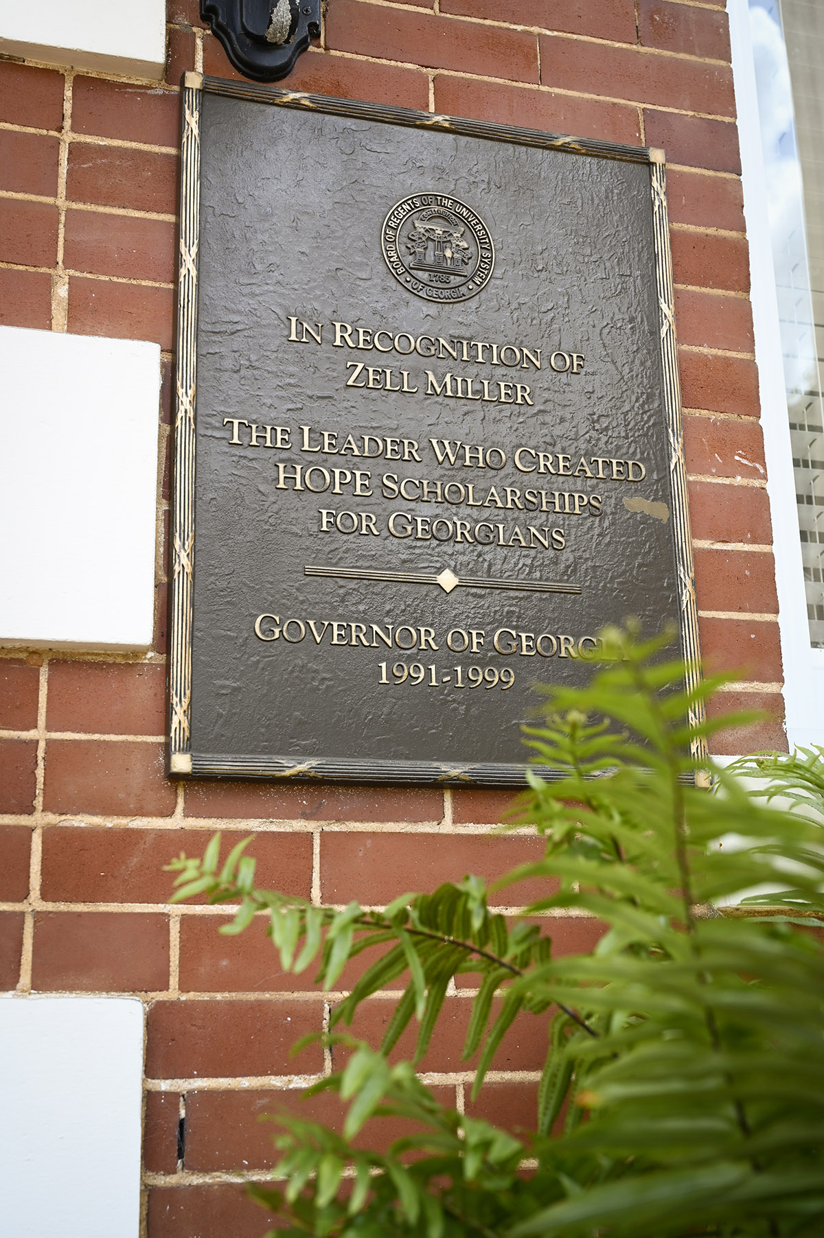 A decorative plaque at the entrance of Parks Hall honors Georgia Governor Zell Miller.