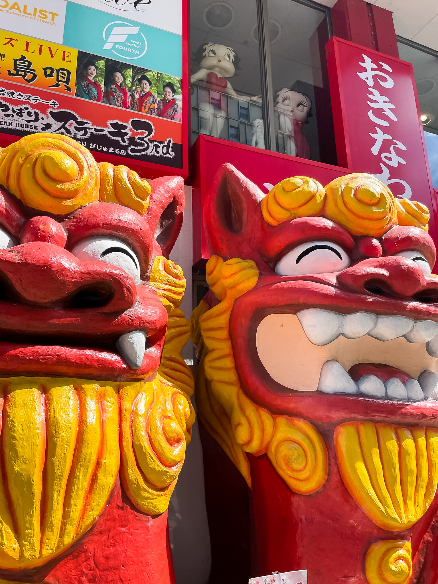 Red and gold Japanese scultures.