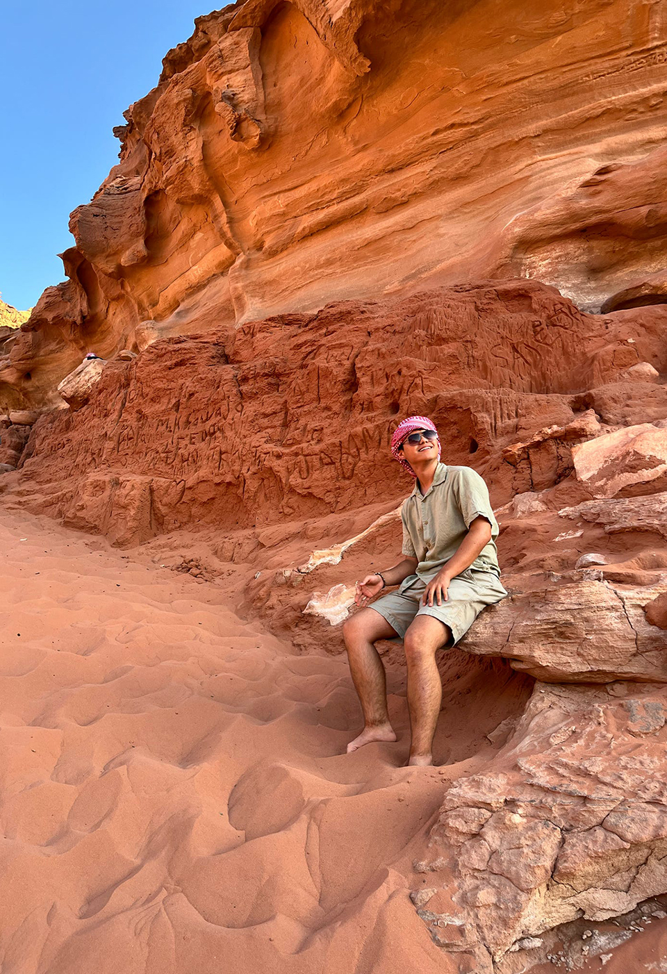 Derek Kim after climbing a large slope of sand in the Wadi Rum Desert—a popular tourist attraction.