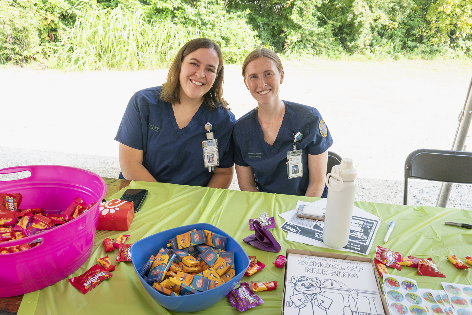 Nursing students run an outreach table at GCSU Gives Day.