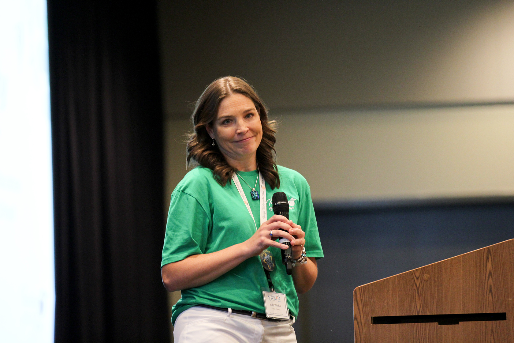 Holly Witcher delivers her "You Matter" address to Georgia's District Teachers of the Year during a conference.