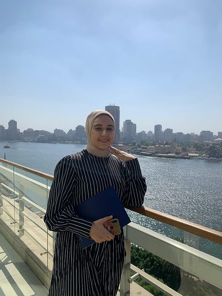 Farah Dawood stands over the Nile River in Cairo, Egypt.