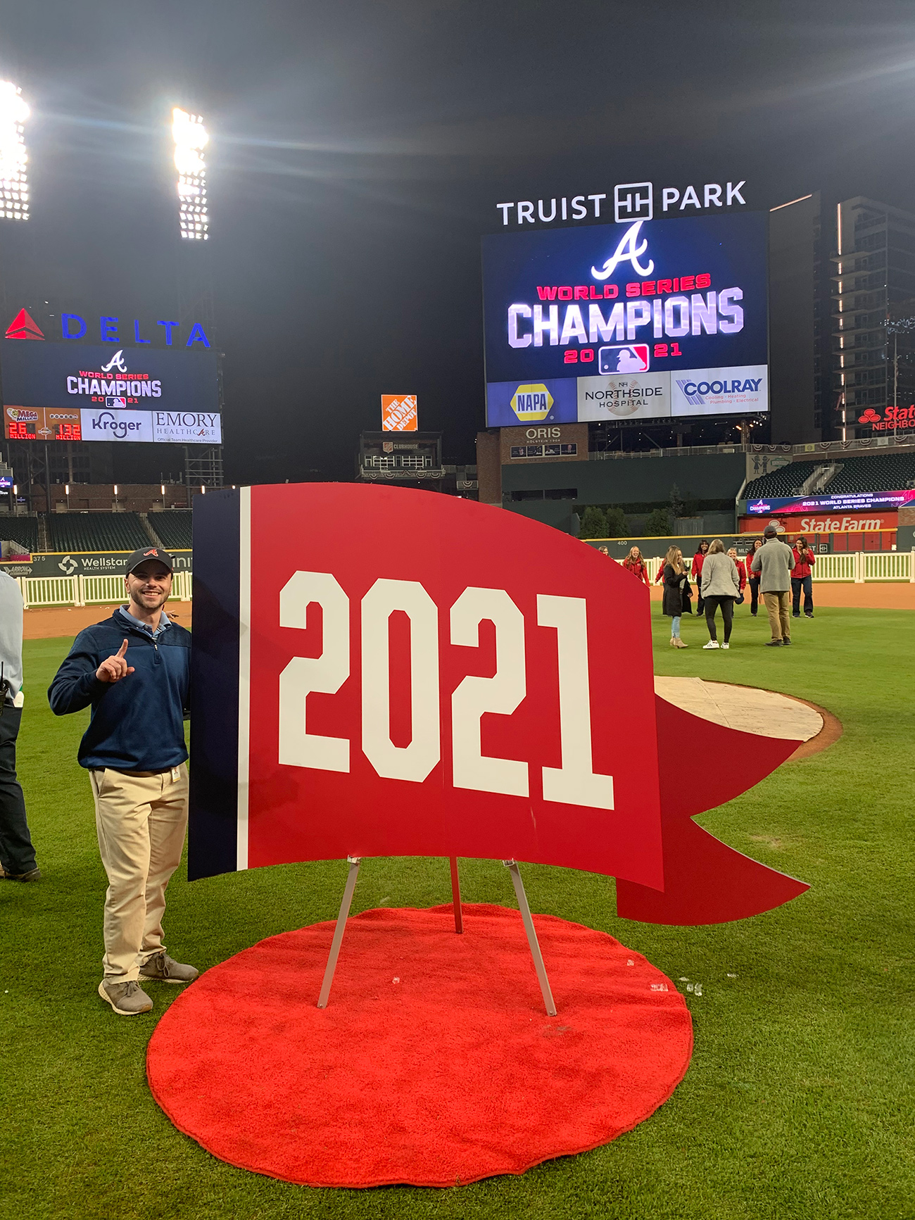 Andrew Rochefort is with the pennant flag after the Atlanta Braves won the 2021 World Series.