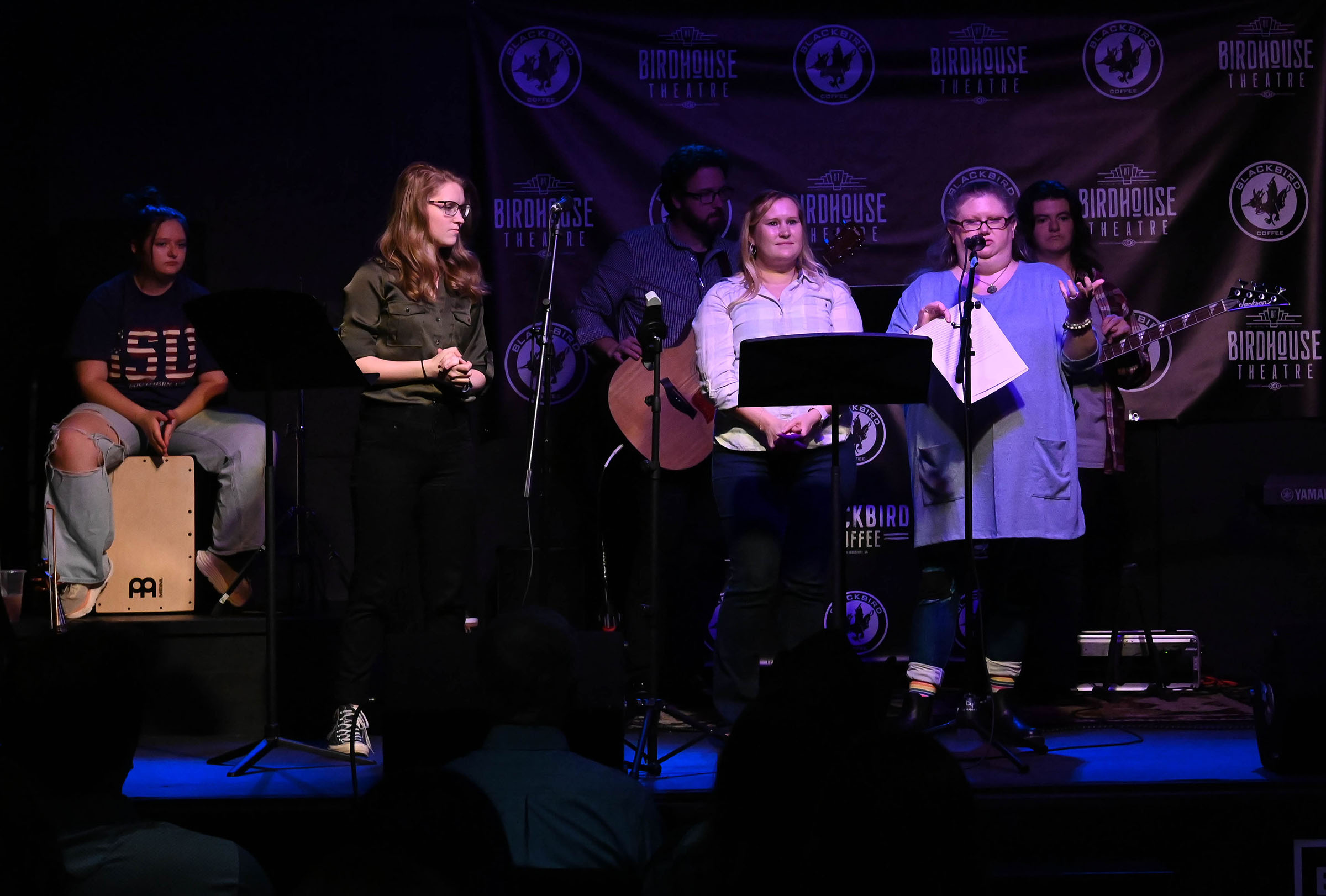 Professor Laurie Peebles and Dr. Stephanie Jett, font center, speak to the audience Tuesday night at the "Sights and Sounds" performance. (Photo by Savannah Greene.)