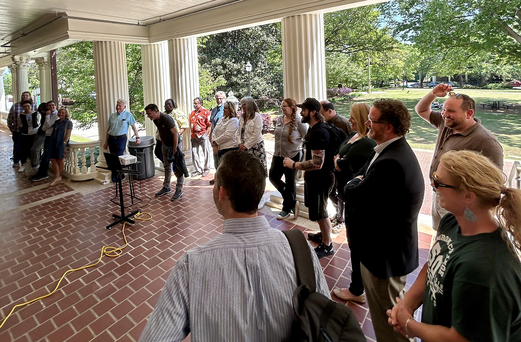 Dr. Scott Dillard (front-center) shares a chuckle with peers.