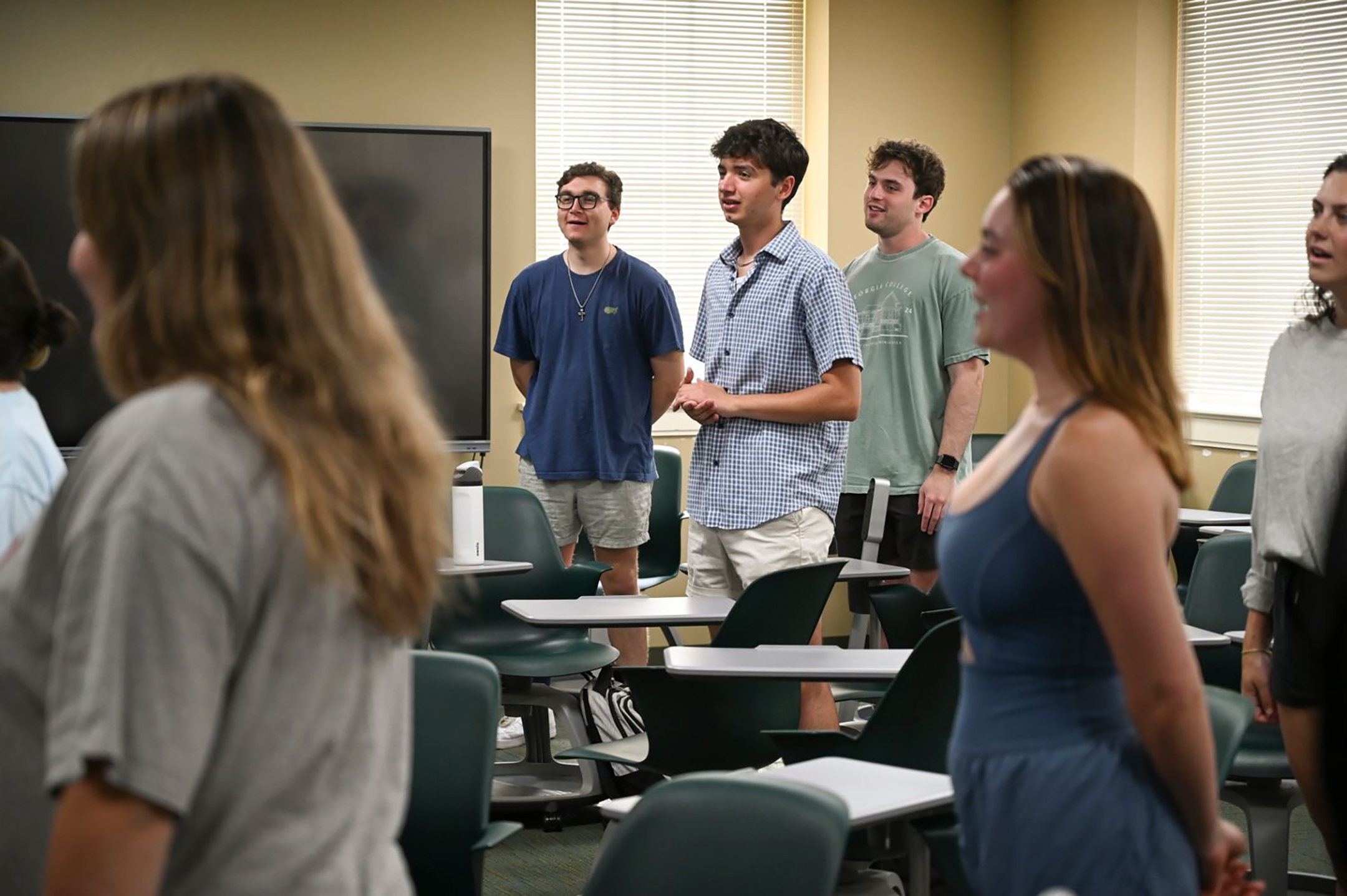 Dr. Scott Dillard's students warm up their voices.