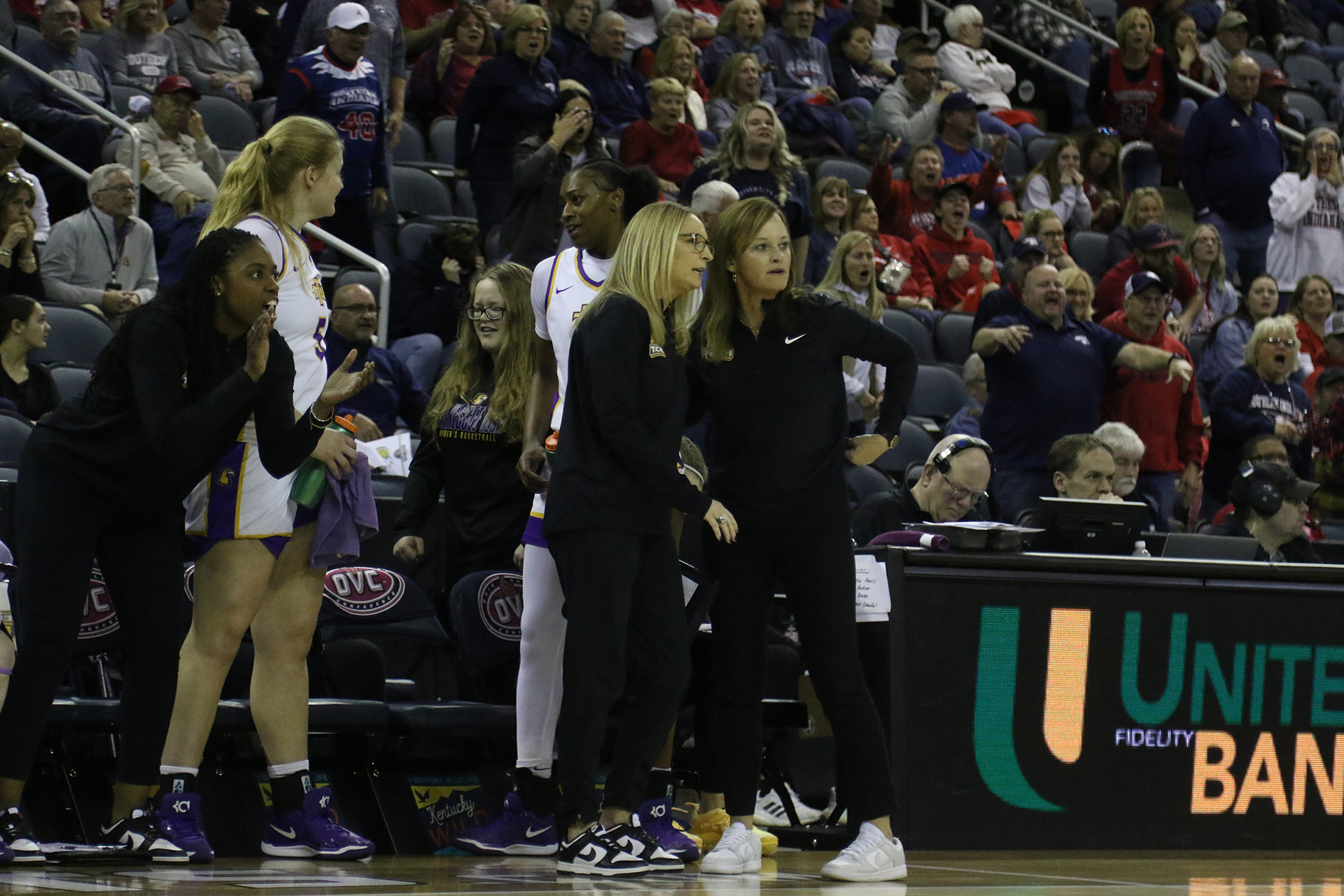 Melanie Walls strategizes with Kim Rosamond about a play.