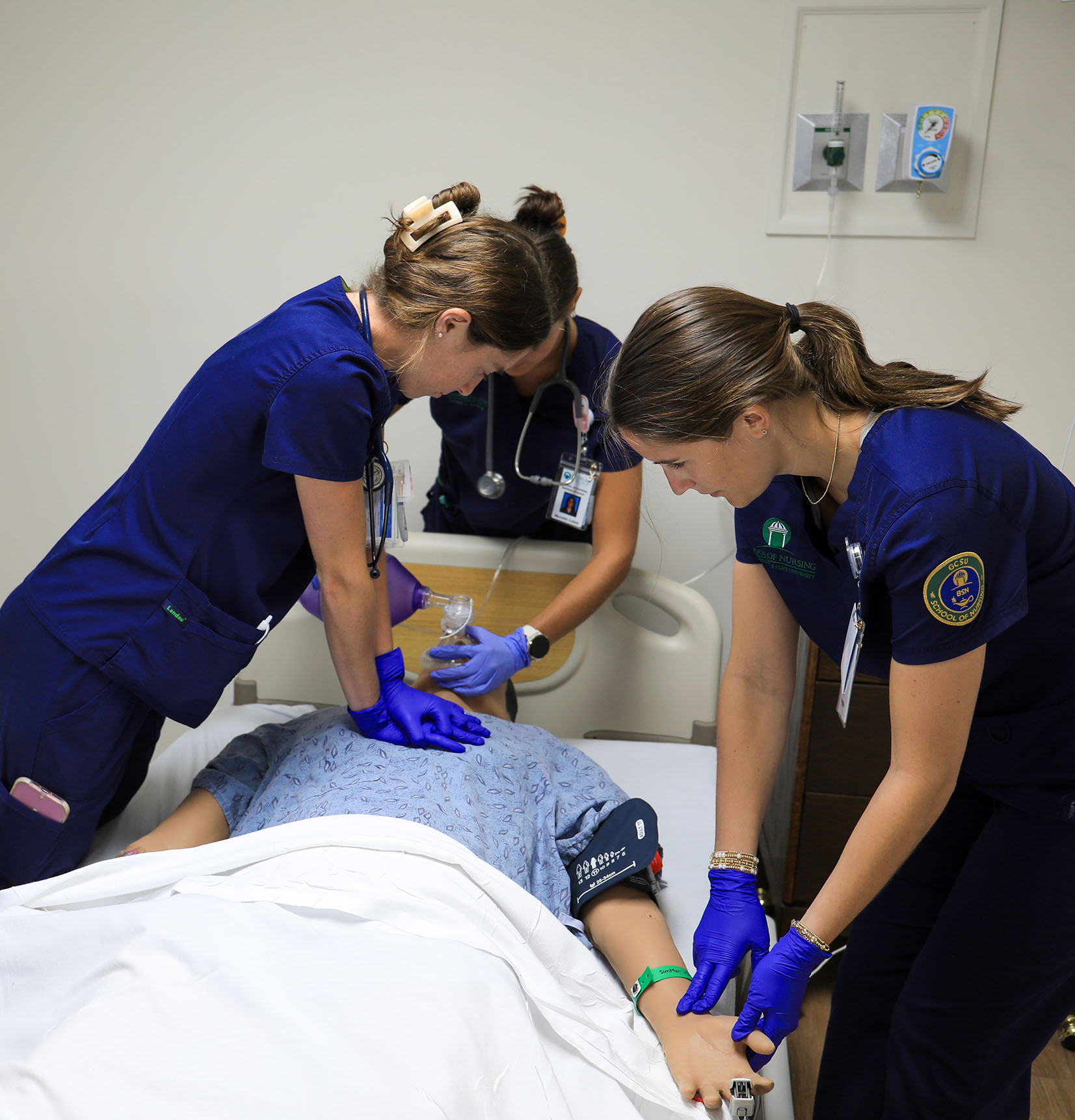 Nursing students practice life-saving techniques using a simulation manikin. (Photo: Gil Pound)