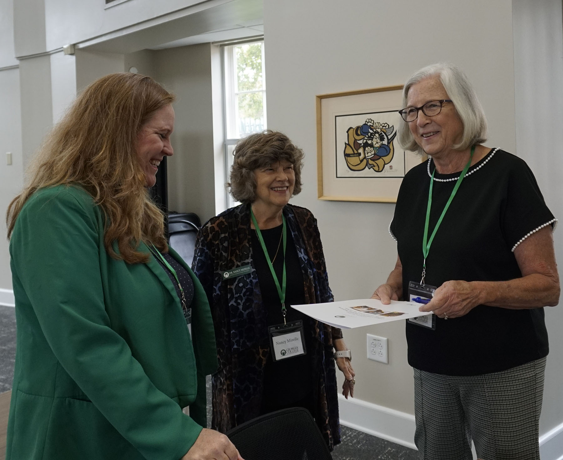 College of Education department chairs Dr. Stacie Pettit (left) and Dr. Nancy Mizelle enjoy a moment with Elizabeth Thomas, John H. Lounsbury's daughter, at right. (Photo: Ian Wesselhoff)