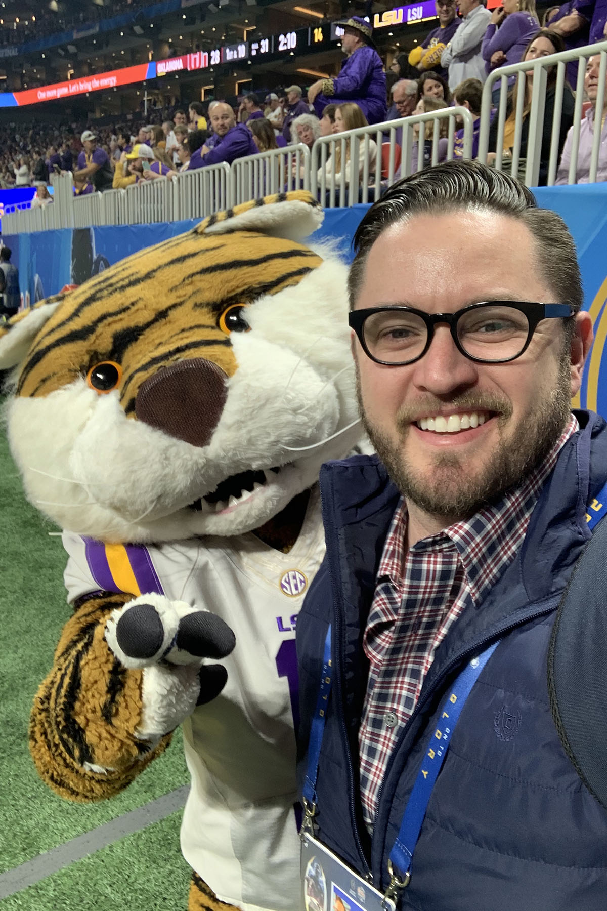 Marler on the sidelines with LSU's mascot Mike the Tiger (Photo: Chris Marler)