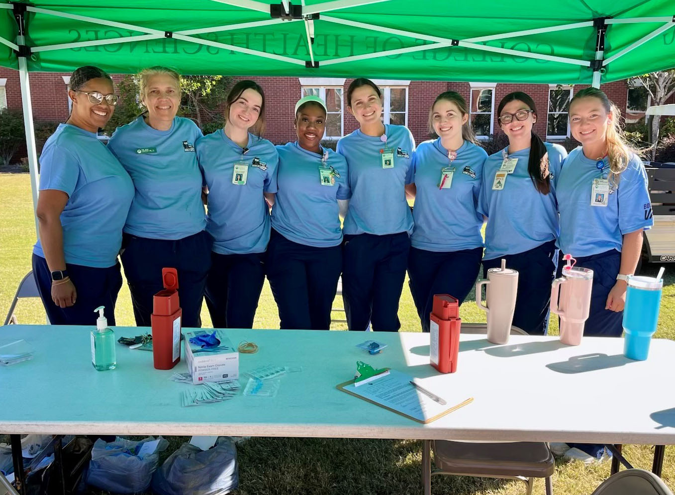 Nursing students and Student Health Services nurse practitioner Kim Griffin at one of the pop-up flu vaccine clinics outside Arts and Sciences.