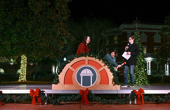 SGA Representatives pull the lever to turn the lights on at GCSU