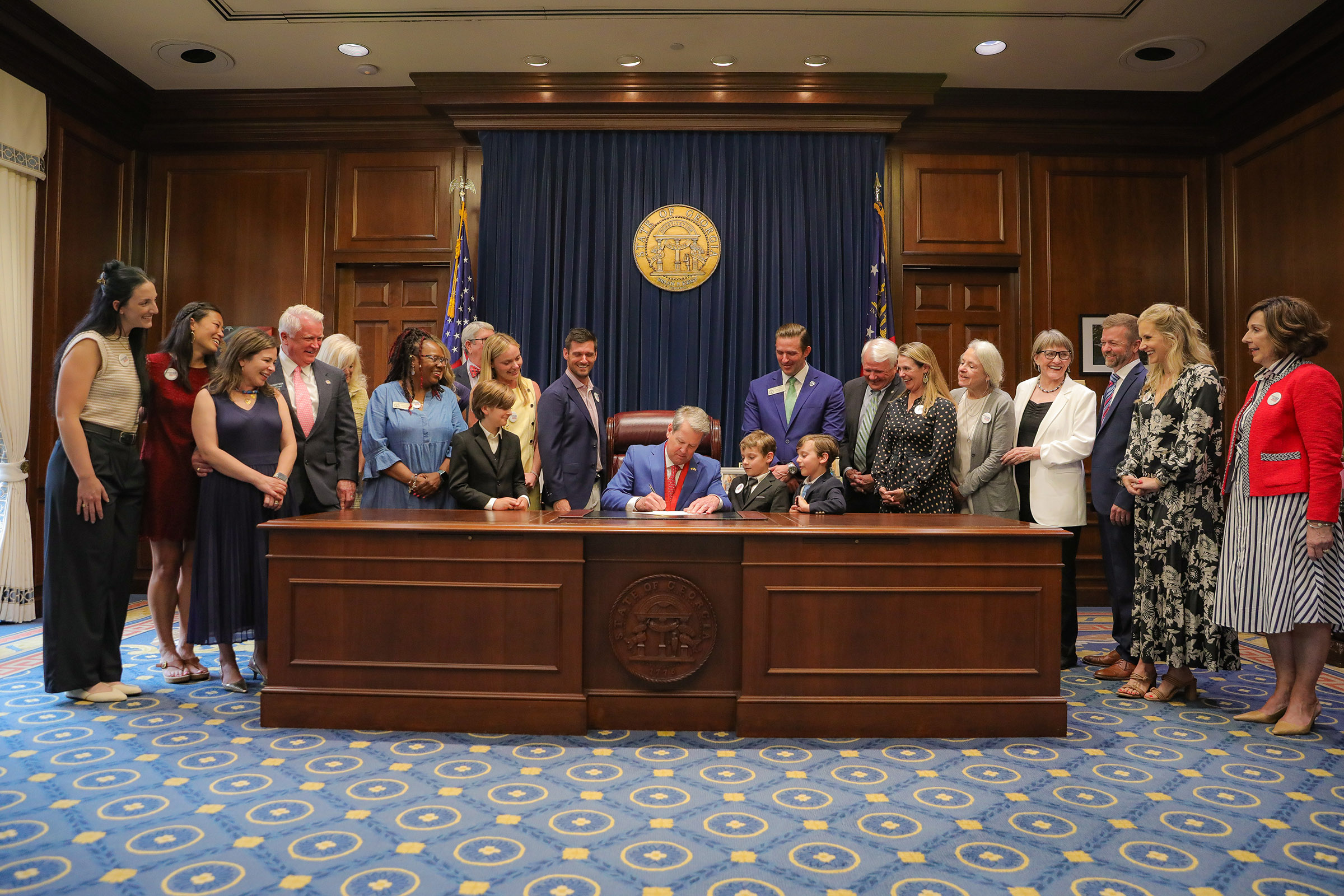 Gov. Brian Kemp signs SB 101, which went into effect Jan. 1, 2026. Alumna Cristalei Polk (‘16) stands second from left. (Photo courtesy of Cristalei Polk)