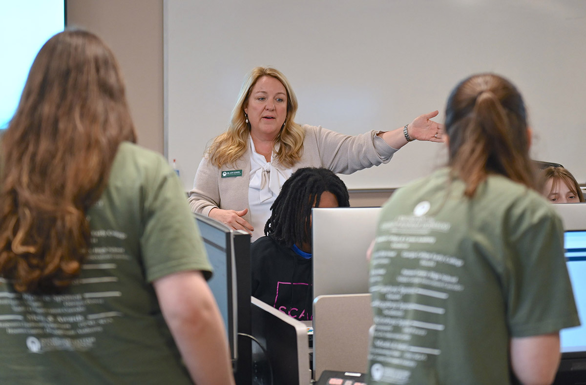 Dr. Joy Godin leads students through the ERP simulation. (Photo: Gil Pound)