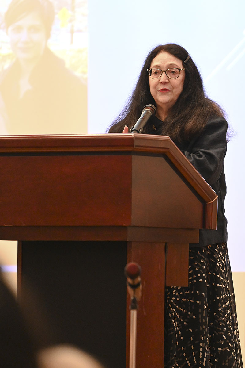 Retired professor Dr. Karen Berman on stage in the Arts and Sciences Auditorium Wednesday evening. (Photo: Anna Gay Leavitt)