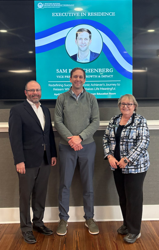 Rauschenberg, center, with College of Business &amp; Technology Dean Faye McIntyre and Department of Economics and Finance Chair, Dr. J.J. Arias. (Photo: Luci De Busschere)