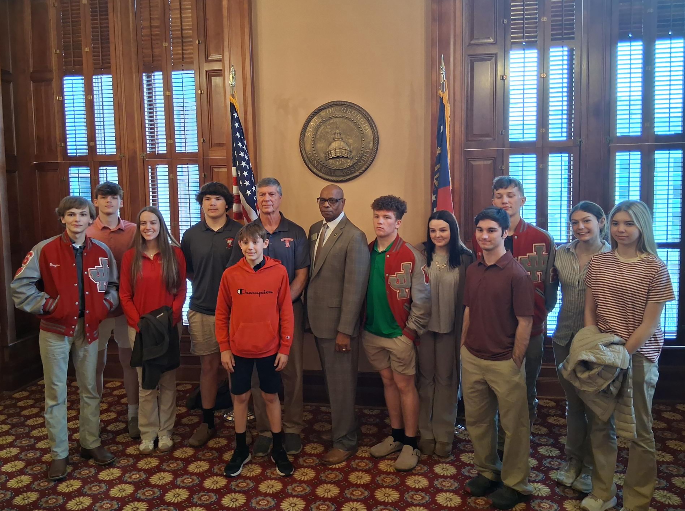 Rep. Mack Jackson and John Hancock Academy students gather in thanks to tour the capital.
