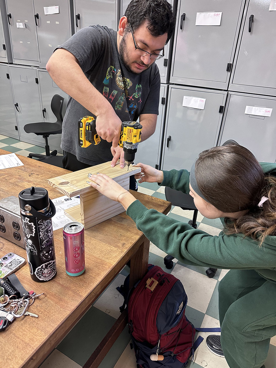 Graduate assistant Hasari Bermudez Soto and junior Sophia Williams build a nest box. Photo: Michelle Moyer