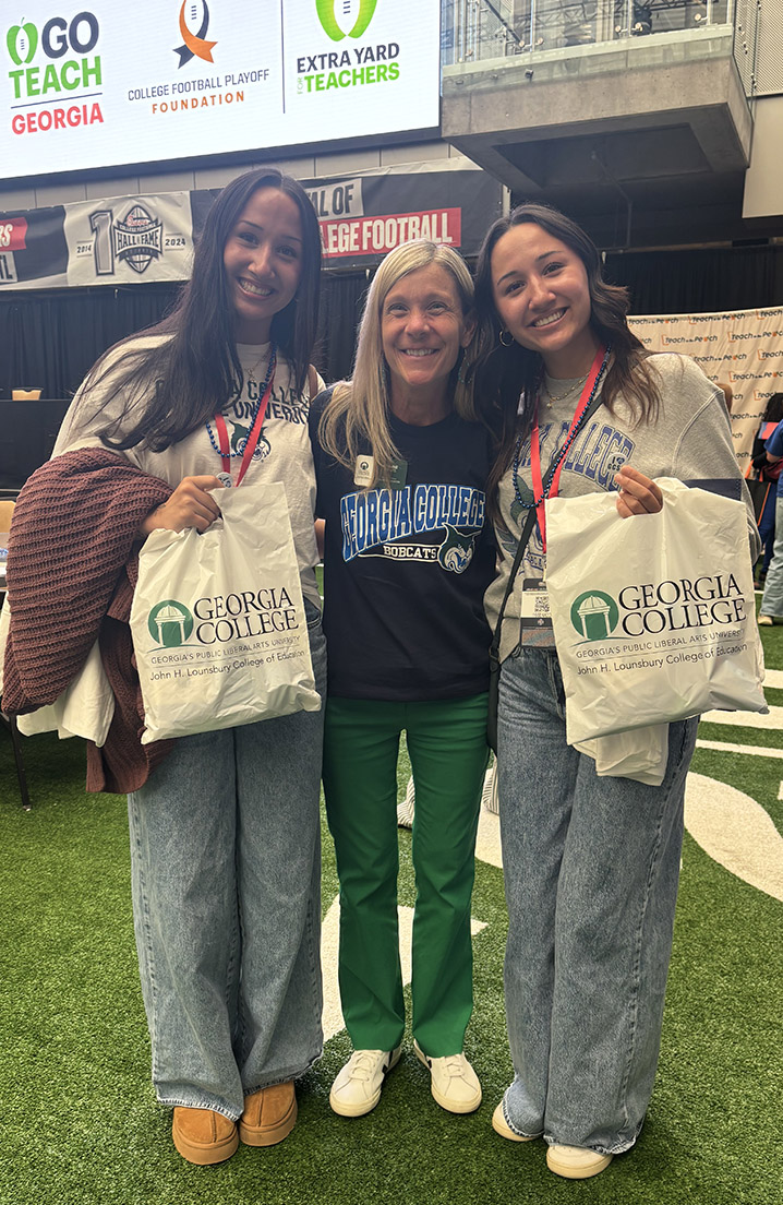 Addison and Anna White with Dr. Joanne Previts, interim dean of the College of Education, at 2025 Teach in the Peach.