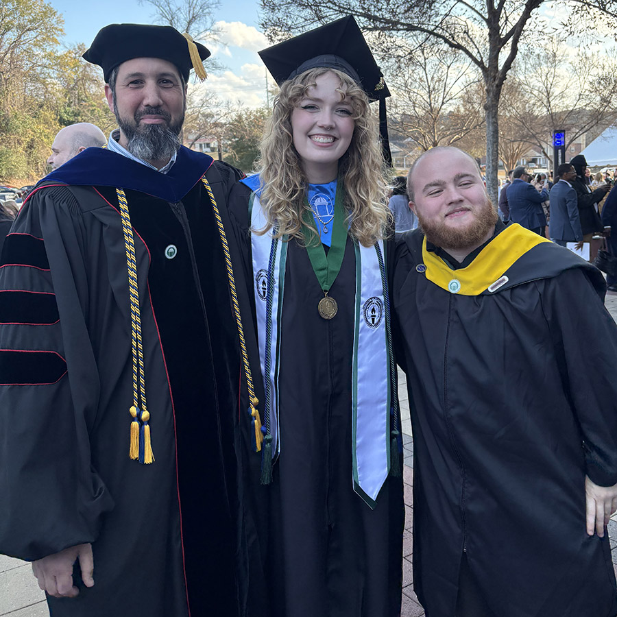 Sydney Irons, center, with biology faculty Bruce Snyder, left, and Lance Andrews at GCSU Commencement. (Photo: Sydney Irons)