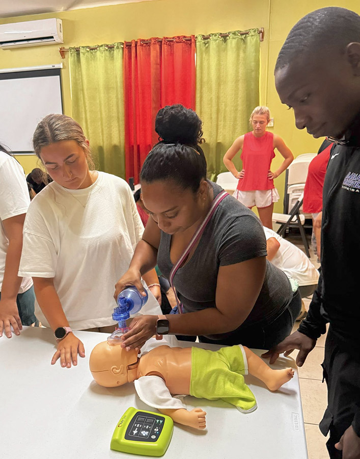Senior Olivia Shuman instructs on how save an infant from choking. (Photo: Olivia Shuman)
