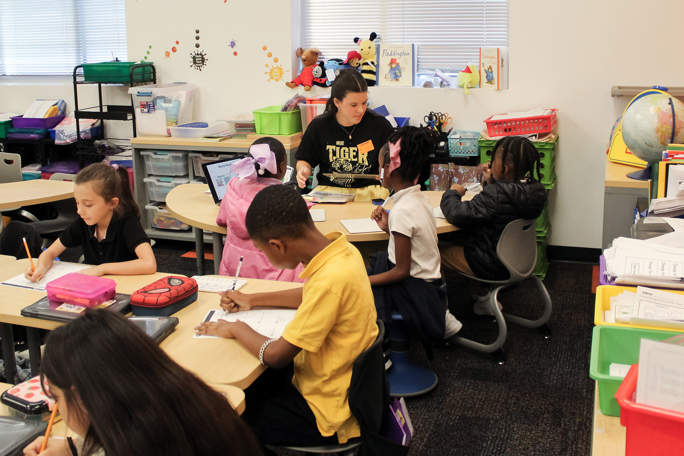 A GCSU student leads a reading exercise in an elementary school classroom