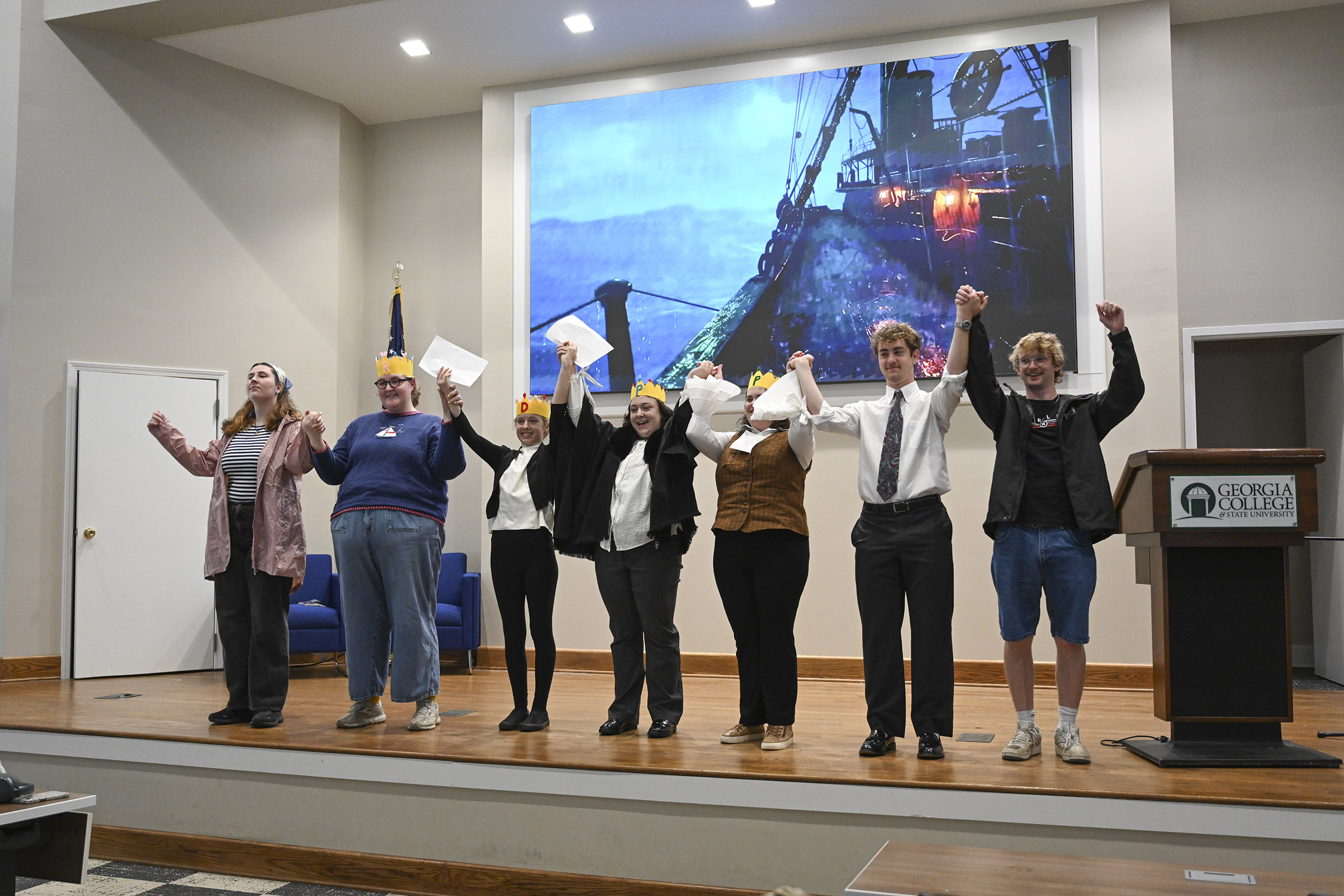 JD Cauley, far right, presents a French play