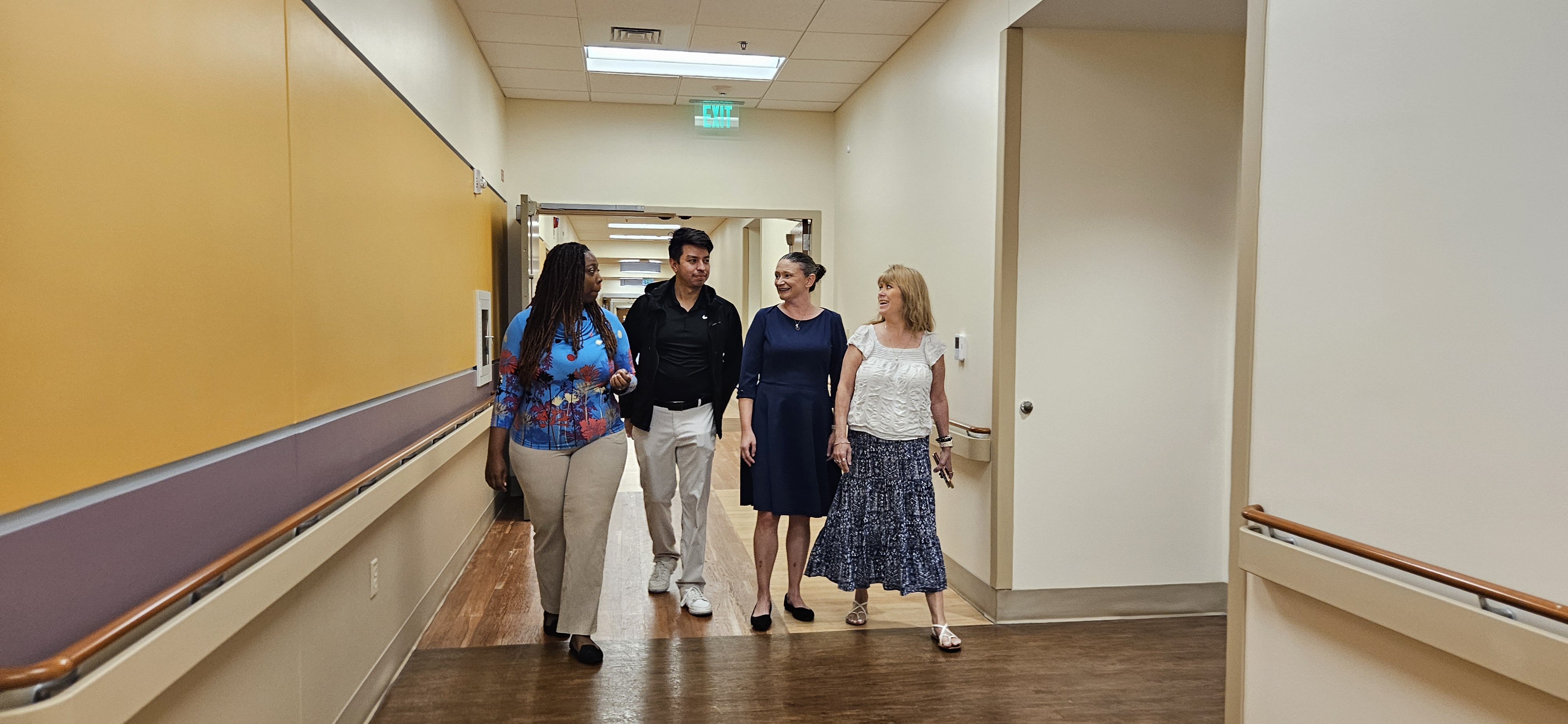 Dr. Kara Boyer (second from left) checks in with her staff.