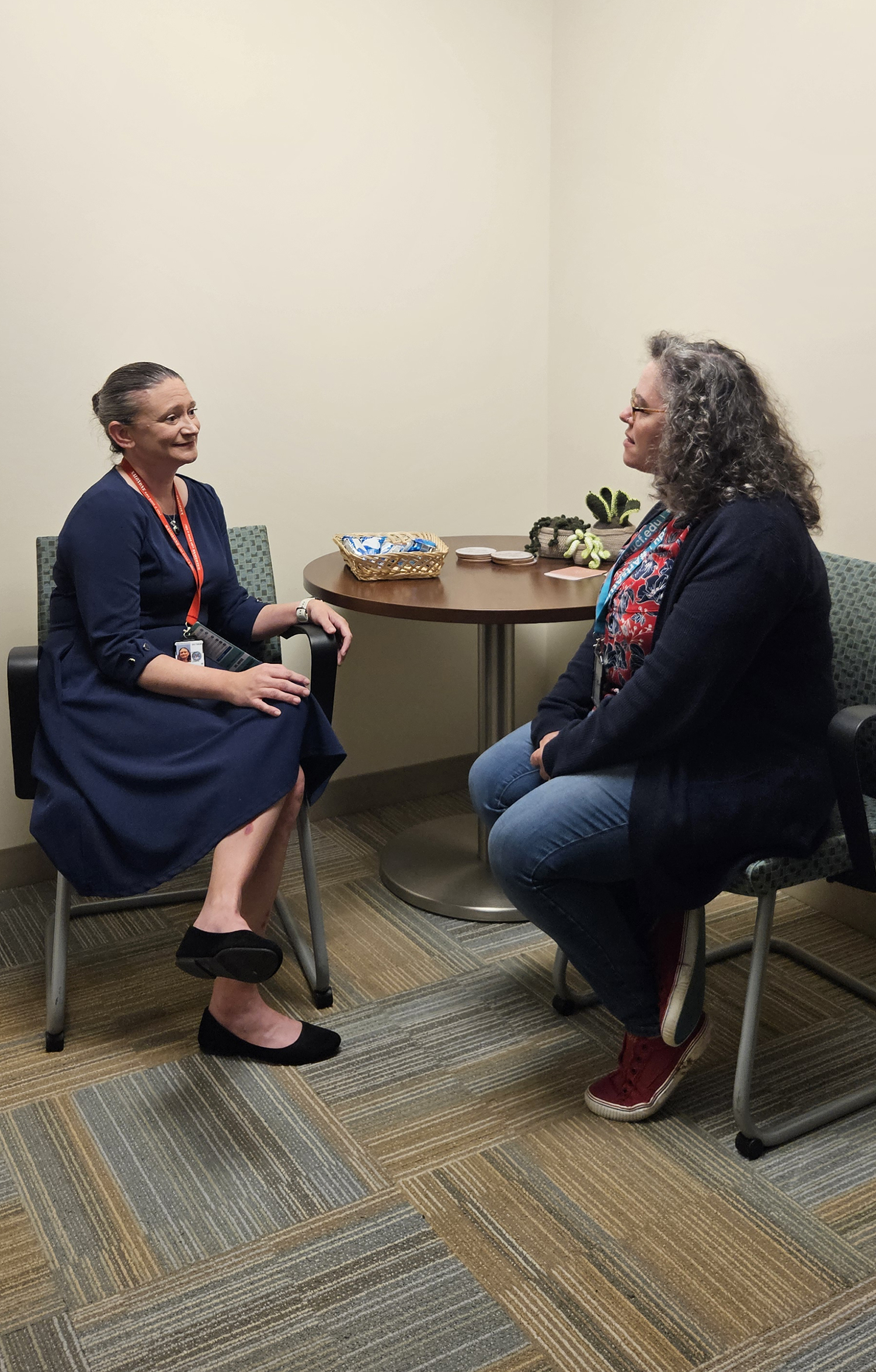 Dr. Kara Boyer (left) meets with the Chief of Social Work Service.