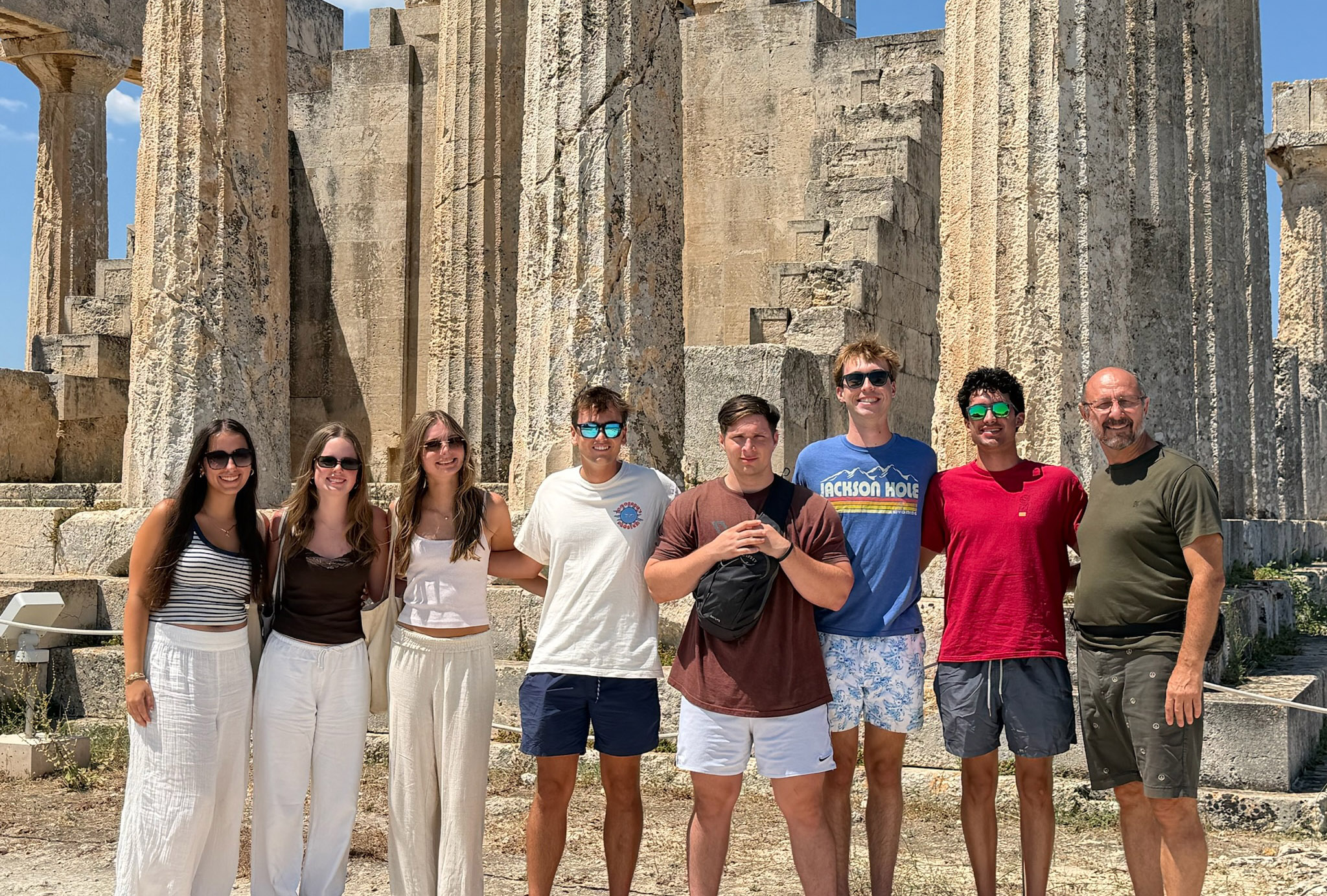 Study abroad students in Greece in front of ancient ruins