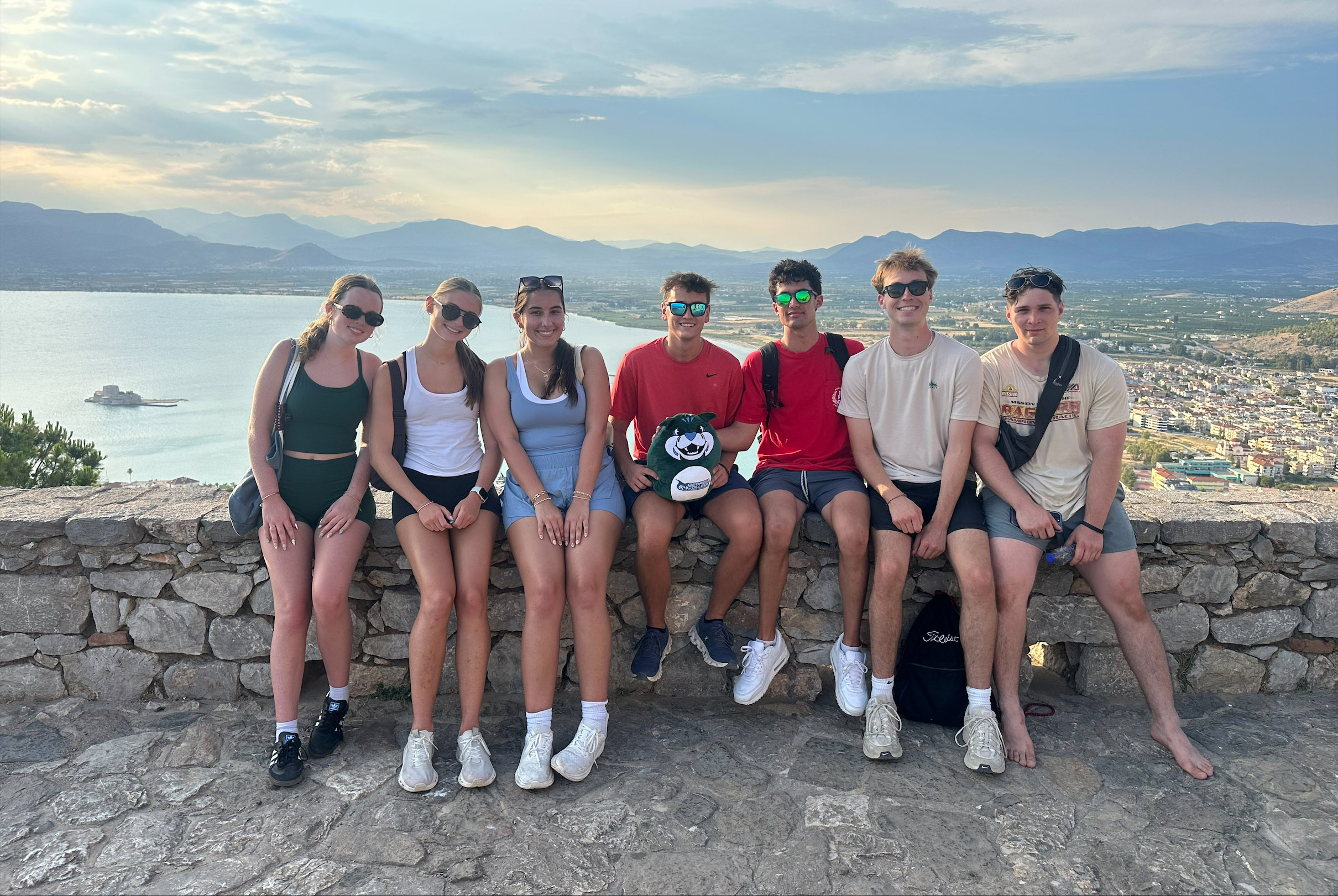 Study abroad students in Greece in front of ocean bay
