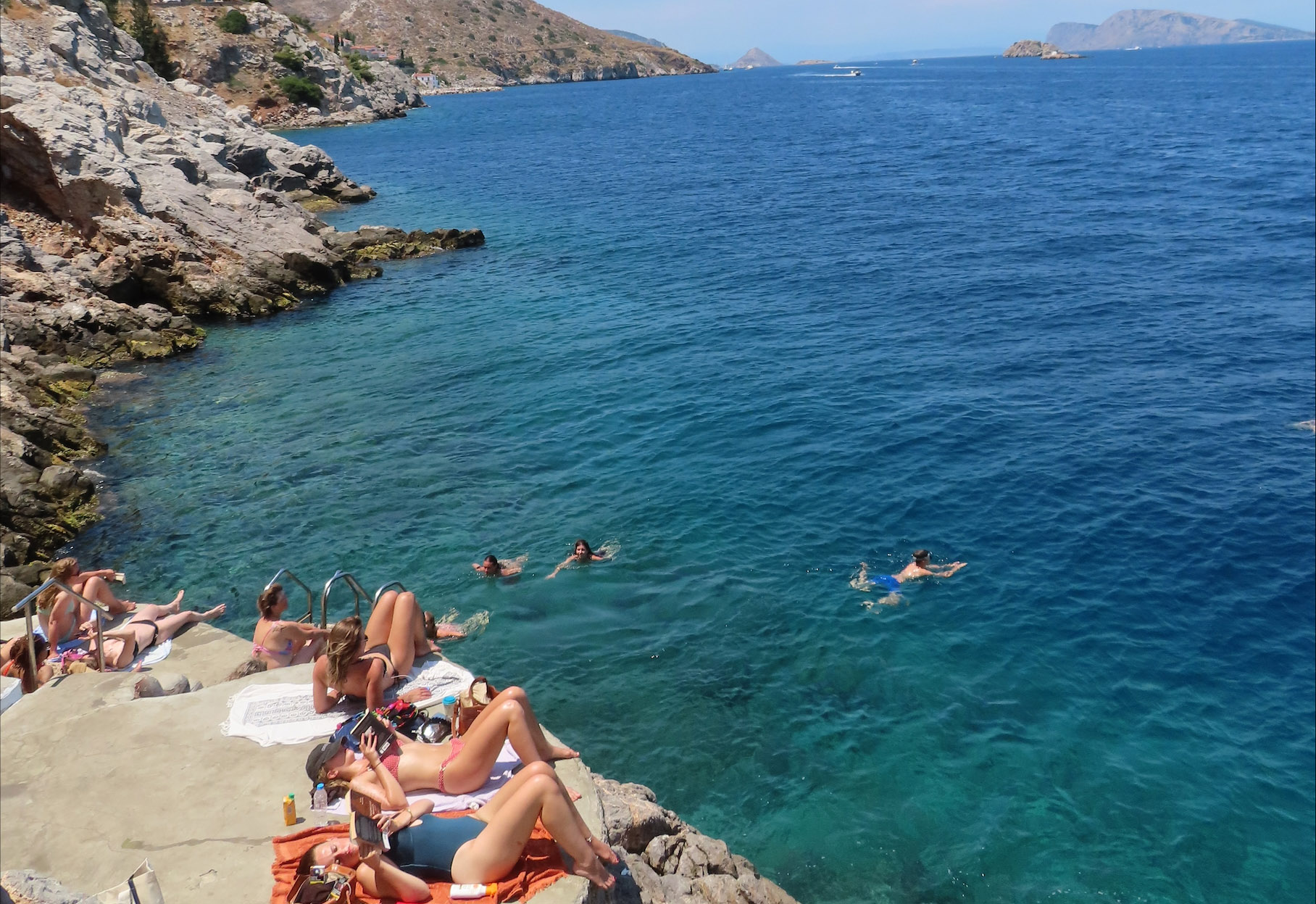 Study abroad students in Greece in front of ocean bay