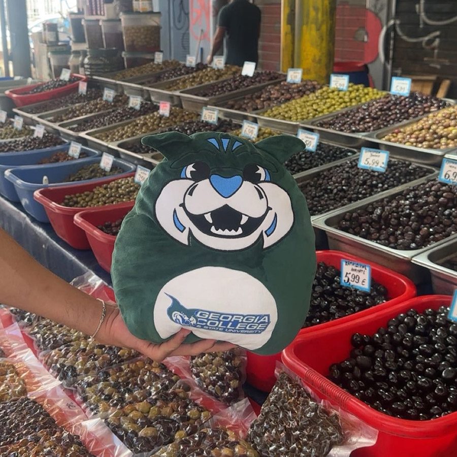 Lil’ Thunder considers his olive options at a farmer’s market in Athens. (Photo: Isabella Burt)