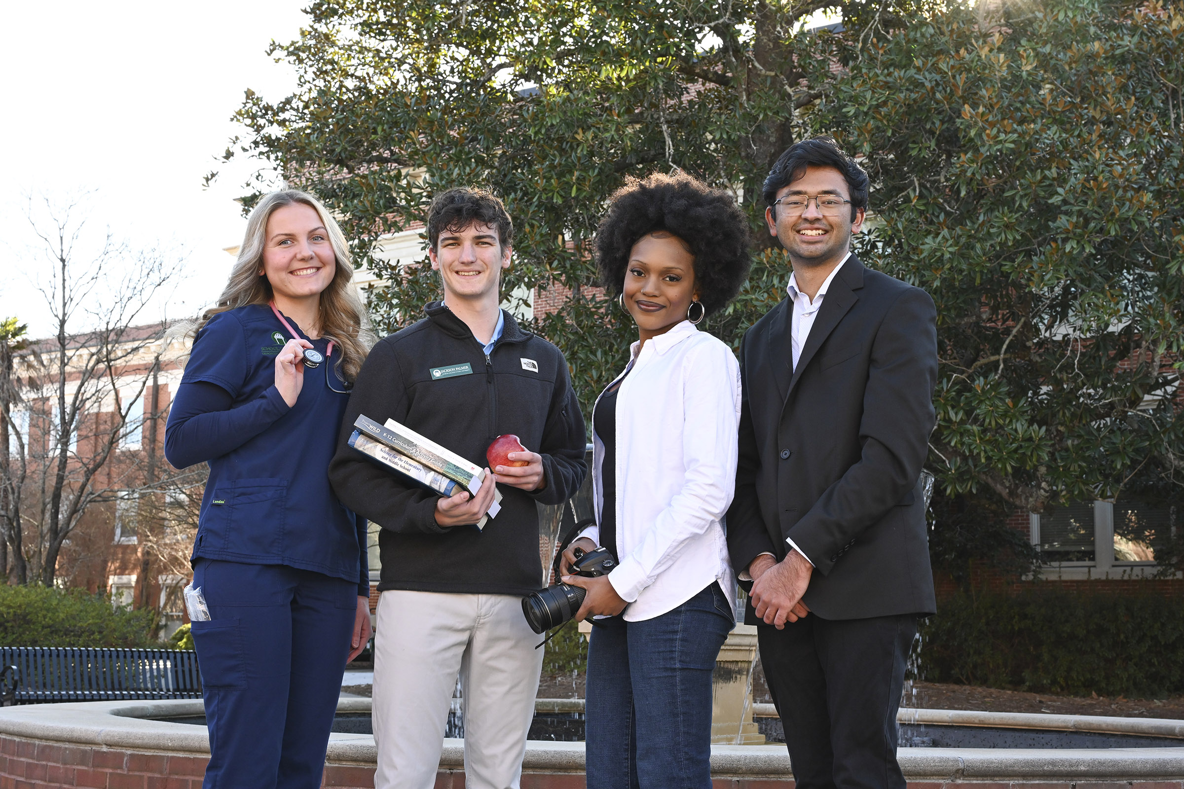 Four GCSU students from each GCSU academic college
