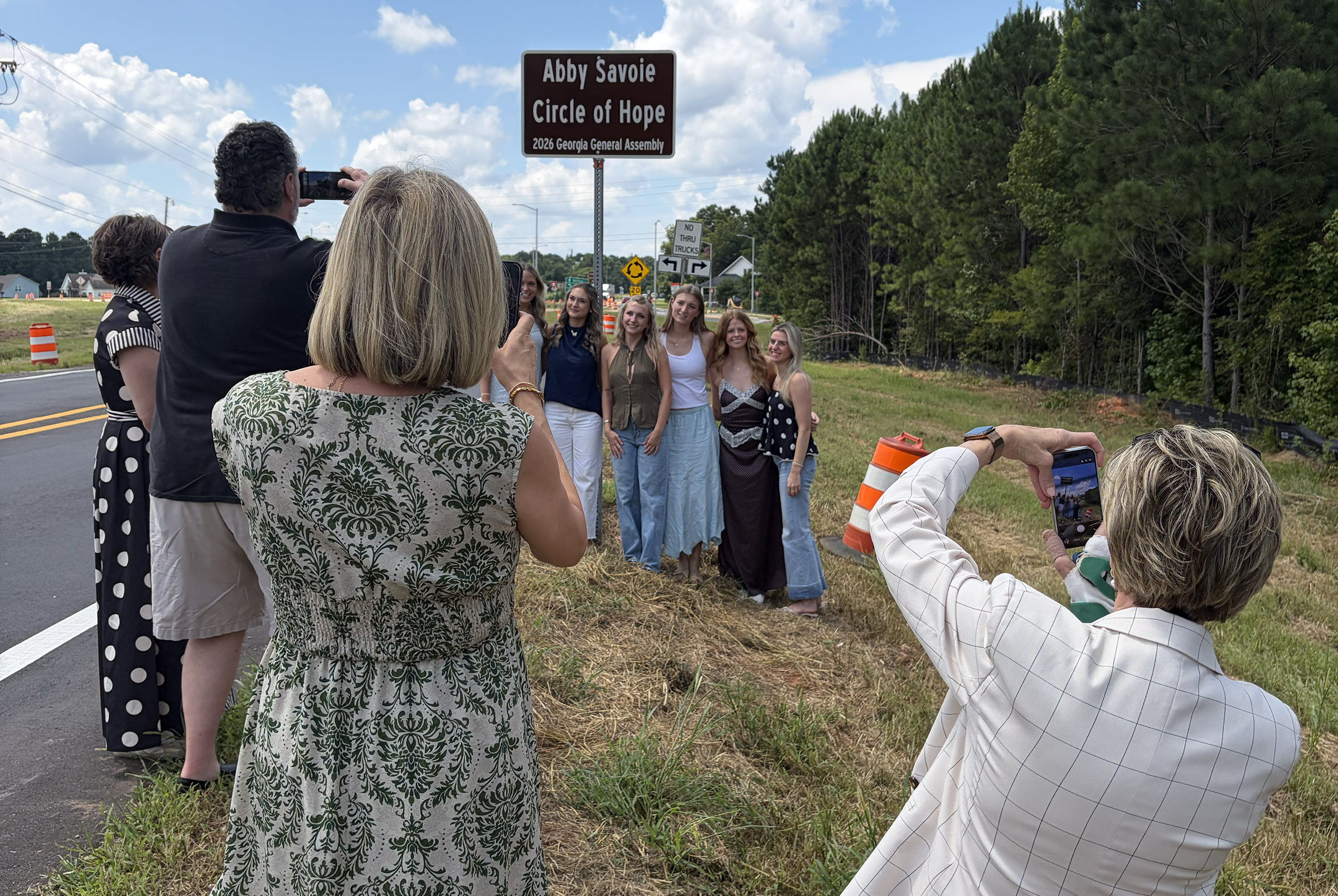 Abby Savoie Circle of Hope GDOT sign and AGD women