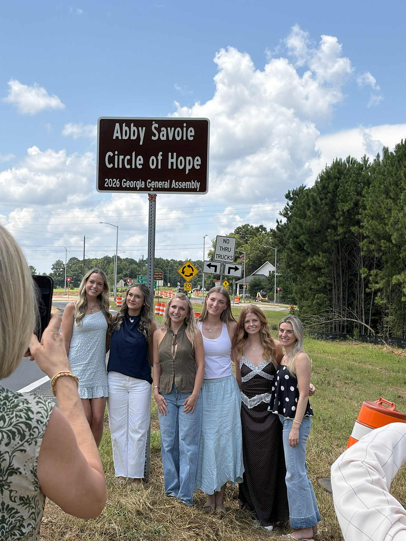 Sisters of Alpha Gamma Delta gather at the Abby Savoie Circle of Hope roundabout on Aug. 5. (Photo: Emily Jarvis)