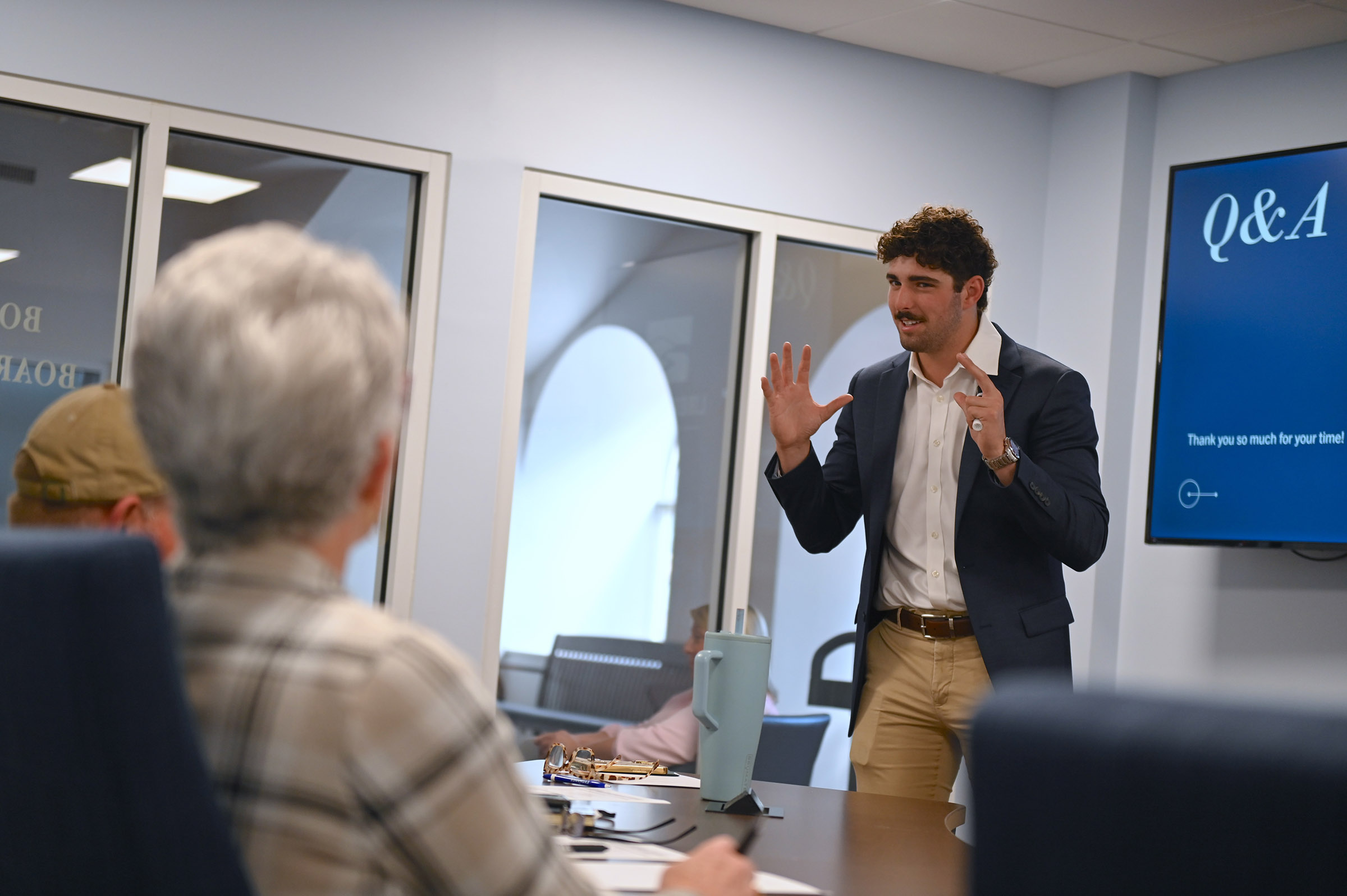 A GCSU student presents in the Bobcat boardroom