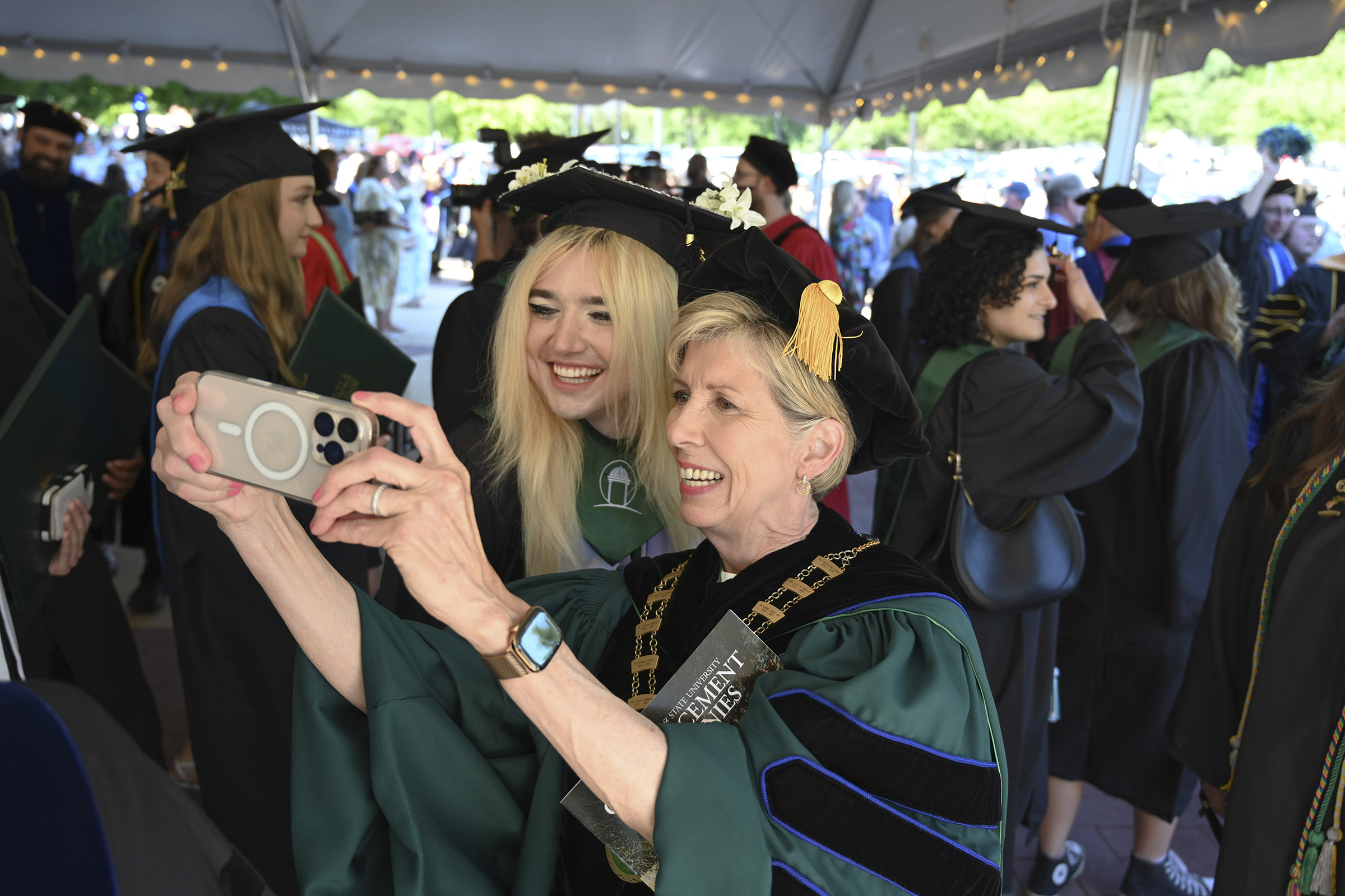 President Cox at commencement with Caleb Rogers