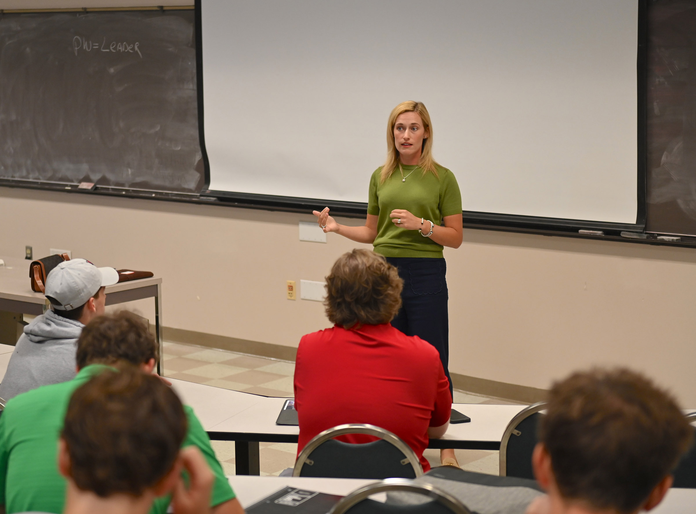 Murph speaking at an open panel and an accounting class. 
