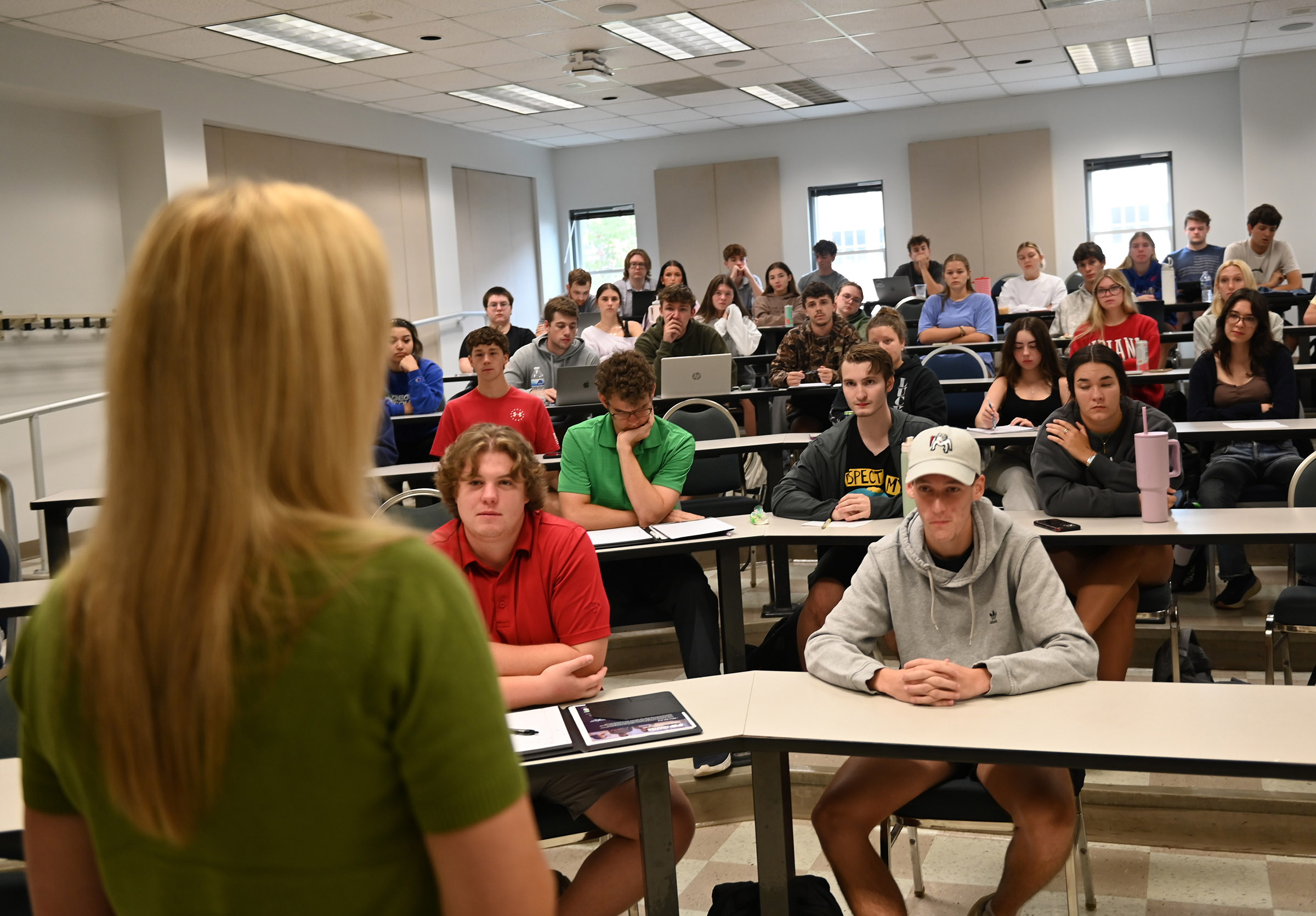 Murph speaking at an open panel and an accounting class. 