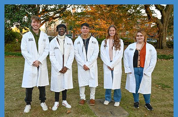 New cohort of NSF S-STEM scholars don the white lab coats of science