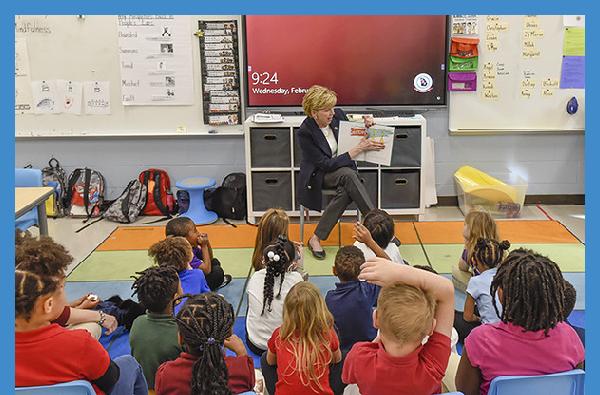President Cox honors the late Sandra Dunagan Deal by sharing story time with local school children