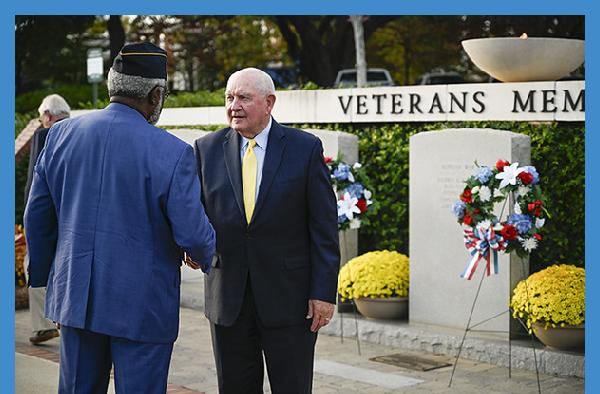 President Cox welcomes Chancellor Sonny Purdue and other dignitaries for Veterans Day Celebration
